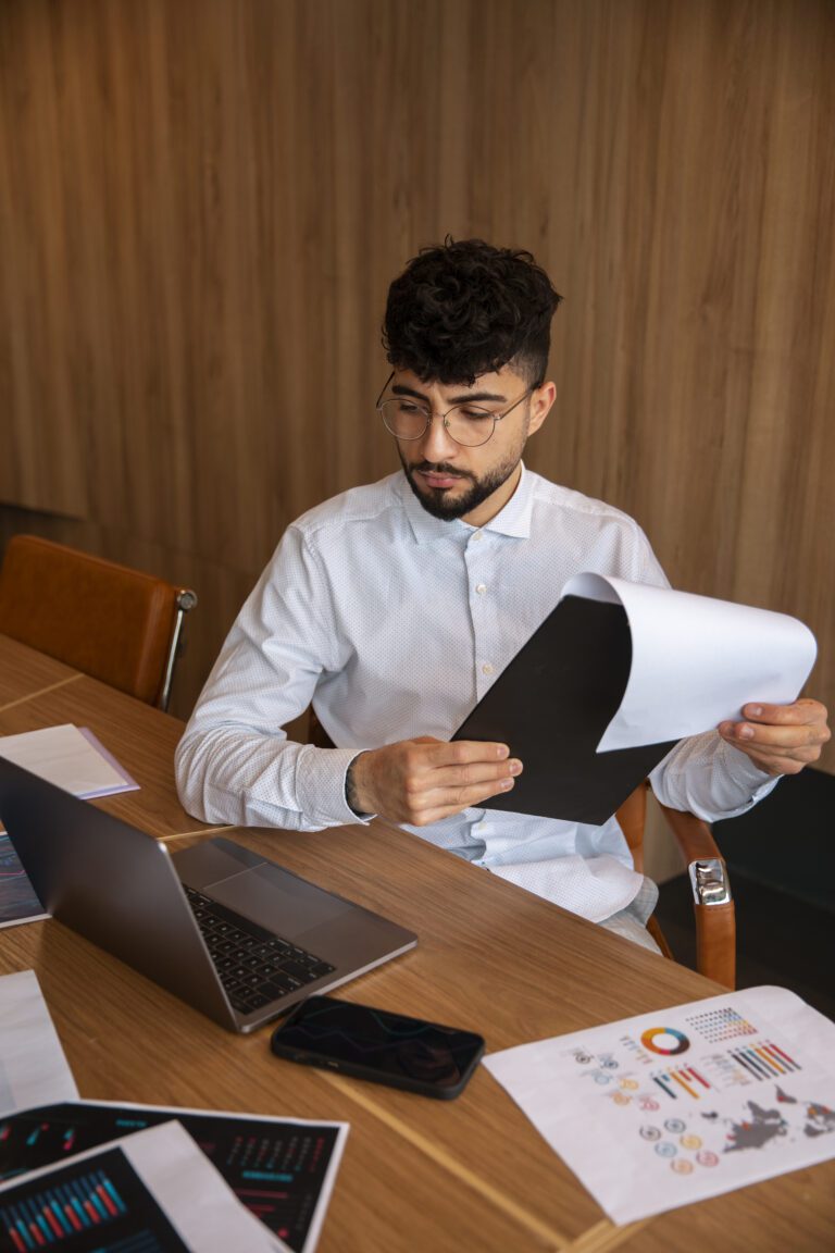 Young man budgeting expenses